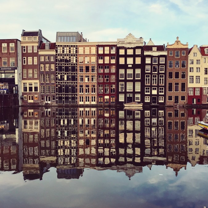Amsterdam houses with reflections in the canal; copyright Kelly Williams